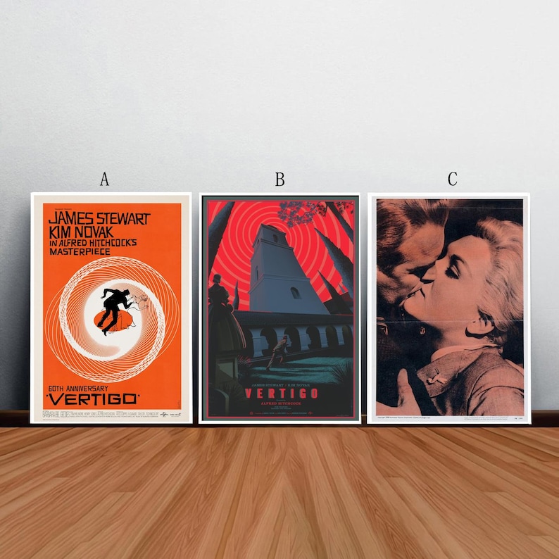 May include: Three movie posters for the film Vertigo, a 1958 Alfred Hitchcock thriller. The posters feature a red and black color scheme with a spiral design, a tall building, and a couple kissing.