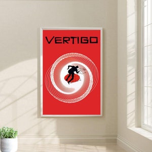 May include: A red poster with the word "VERTIGO" in black text at the top. A white spiral design with a black silhouette of a couple dancing is in the center of the poster.