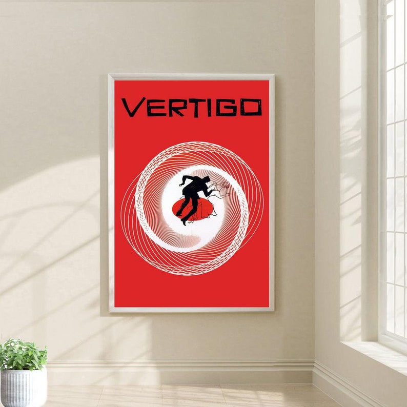 May include: A red poster with the word "VERTIGO" in black text at the top. A white spiral design with a black silhouette of a couple dancing is in the center of the poster.