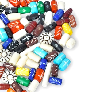 May include: A collection of colourful wooden beads with various patterns and designs. The beads are made of natural wood and have a smooth, polished finish. They are perfect for crafting jewellery, making bracelets, or adding a touch of rustic charm to your home decor.