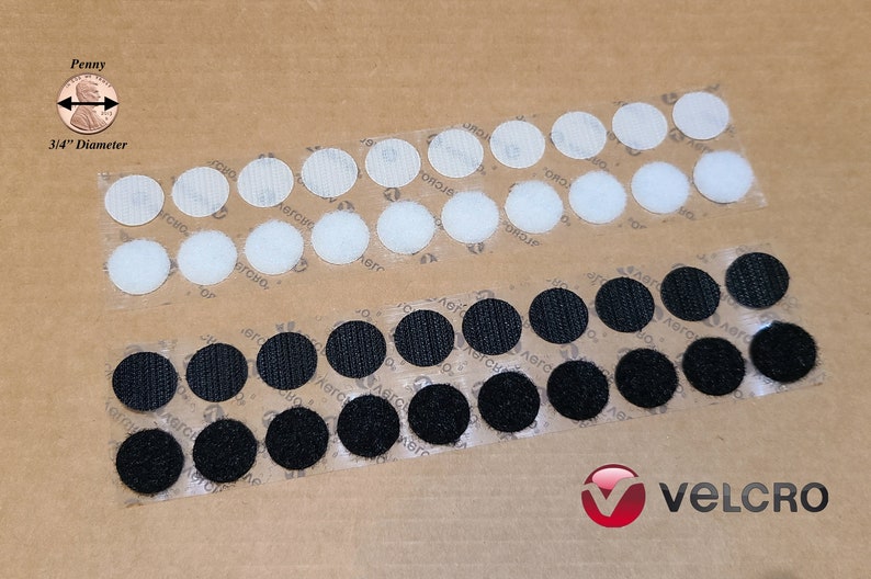 May include: Two strips of VELCRO brand hook and loop fasteners. The top strip has 20 white, round, adhesive-backed hook fasteners. The bottom strip has 20 black, round, adhesive-backed loop fasteners. The fasteners are approximately 3/4 inch in diameter.