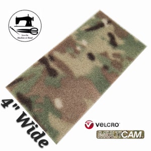 May include: A 4-inch wide strip of hook and loop fastener in Multicam camouflage. The strip is made of a soft, fuzzy material and is designed to be sewn on by machine or hand. The strip is labeled "VELCRO" and "MULTICAM".