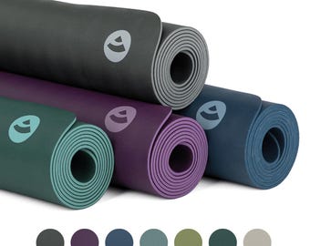 May include: A set of six yoga mats in various colors, including gray, purple, blue, teal, green, and beige. Each mat has a logo in the center.