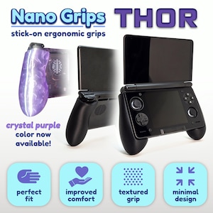 May include: Nano Grips THOR stick-on ergonomic grips for a handheld gaming console. The product features a crystal purple textured grip and a black grip attached to a black console. Text includes Nano Grips, THOR, and crystal purple color now available.