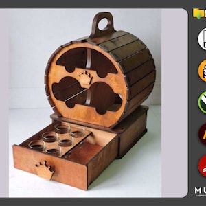 May include: A wooden barrel-shaped liquor dispenser with a drawer that opens to reveal shot glasses. The dispenser has a crown design on the front and is made of light brown wood.