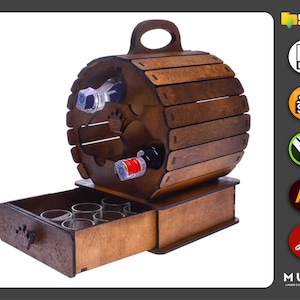 May include: Wooden wine rack shaped like a barrel with a drawer for shot glasses. The rack has a handle on top and is made of dark wood.