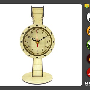 May include: A wooden clock with a round face and black hands. The clock is mounted on a wooden stand with a base. The clock face has black numbers and a brown background.