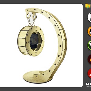 May include: A wooden clock kit with a circular clock face and a curved stand. The clock face is made of wood and has a cutout for the clock mechanism. The stand is made of wood and has a curved shape. The clock kit is designed to be assembled and decorated.