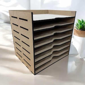 May include: A brown wooden paper organizer with eight shelves. The shelves have black edges and are slightly curved. The organizer has a grid pattern on the front.