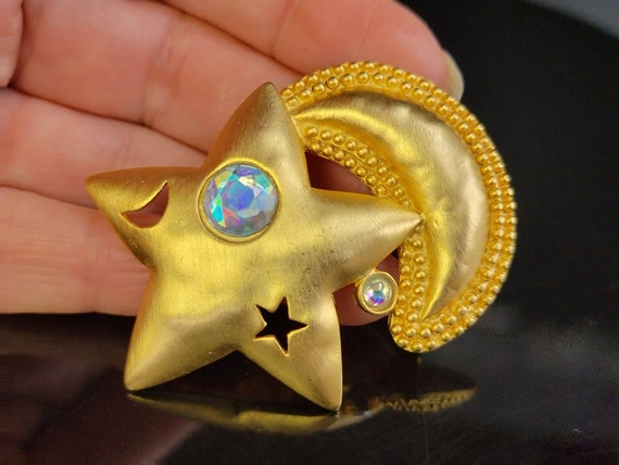 JJ brushed gold Star and moon brooch, A crystal s… - image 1