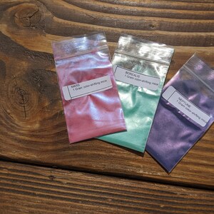 May include: Three small plastic bags containing 1 gram of color-shifting mica powder. The bags are labeled "Mars", "Borealis", and "Neptune".