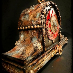 May include: A steampunk-style clock with a weathered, metallic finish. The clock features visible gears, chains, and intricate detailing, with a red clock face. The design incorporates shades of brown, gold, and blue, creating a vintage aesthetic.