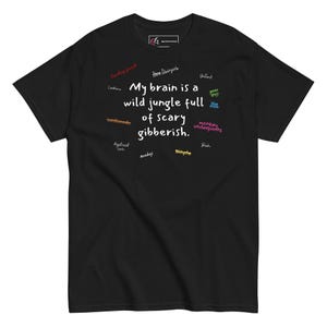May include: Black t-shirt with the slogan "My brain is a wild jungle full of scary gibberish." The design includes various words like "hockey pack," "ten Unicycle," and "monkey underpants" scattered around the main text.
