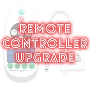 May include: A white remote control with multiple buttons and the text "REMOTE CONTROLLER UPGRADE" in red. The remote has buttons for speed and time settings. A small white device is also visible.