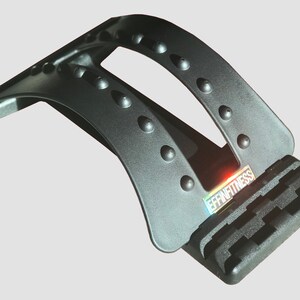 May include: Black back stretcher with a textured surface and a row of raised bumps. The stretcher has a handle on the top and a base with the word "EFFIN FITNESS" printed on it.