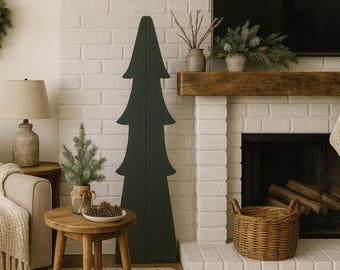 Timeless porch leaner tree handcrafted from reclaimed pallet wood lumber. Eco-friendly outdoor Christmas decor & winter porch decoration.