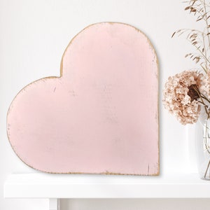 Large 12" antique style wooden heart shaped shelf leaner. Rustic shabby chic home decor with distressed pink paint.