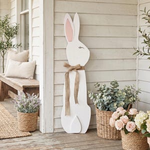 3D detailed large wooden porch leaner sitting white bunny rabbit with burlap bow and peaceful expression. Handcrafted Spring & Easter Decor