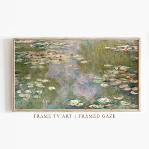 May include: A framed painting depicting a pond with water lilies and lily pads. The water is a light blue-green colour and the lily pads are a light green colour. The painting is in a light wood frame.