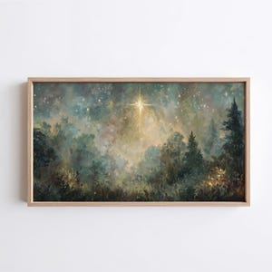 May include: A framed landscape painting depicts a forest scene with a bright star in the sky. The artwork features a palette of greens, blues, and golds, with detailed trees and a starry night sky. The frame is made of light-colored wood.