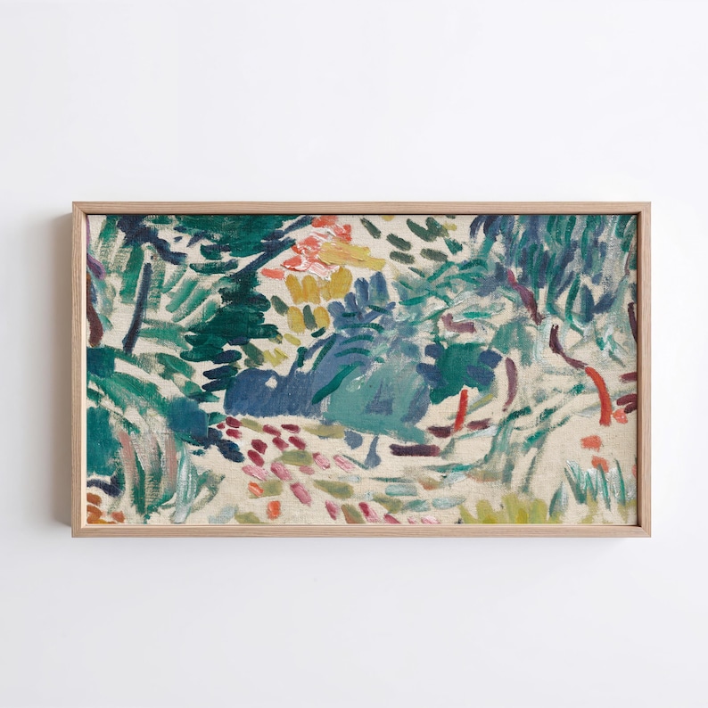 May include: A framed abstract painting with a natural theme. The artwork features a vibrant mix of colors, including greens, blues, yellows, and reds, creating a dynamic and textured landscape. The painting is encased in a light-colored wooden frame.