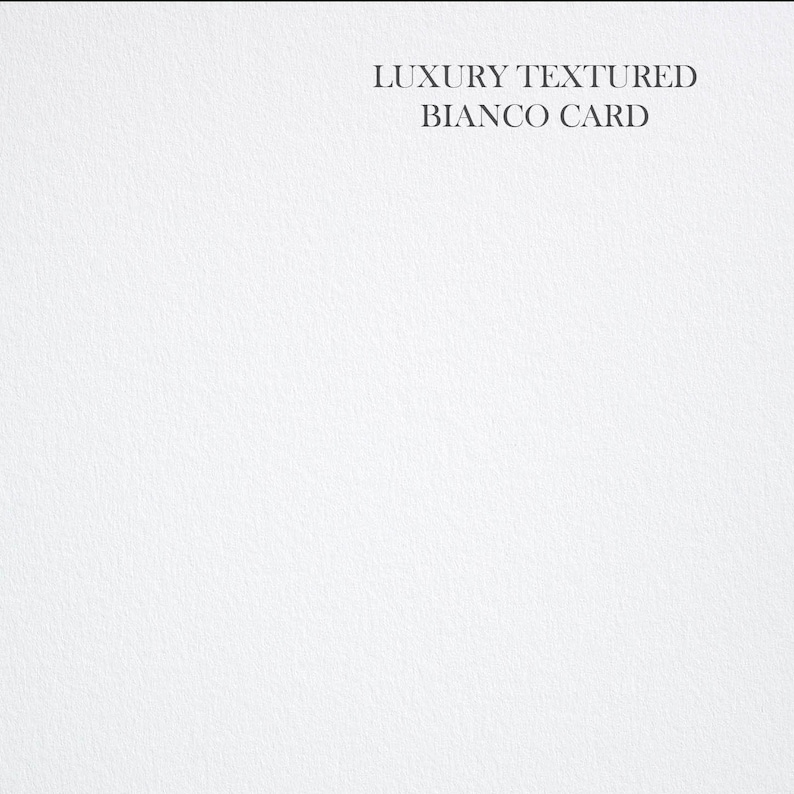 May include: A close-up of a white textured card with the text "LUXURY TEXTURED BIANCO CARD" printed in black.