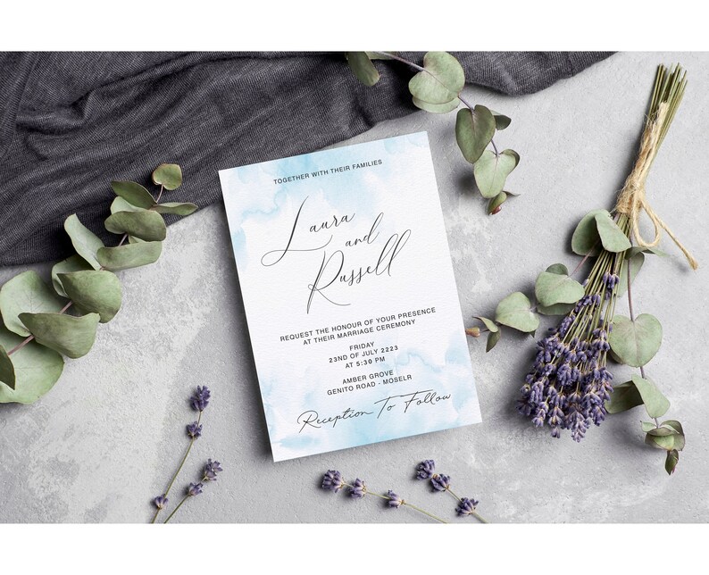 May include: A wedding invitation with a watercolor background in shades of blue. The invitation reads "Laura and Russell" and includes the date, time, and location of the wedding ceremony. The text "Reception to Follow" is also included.
