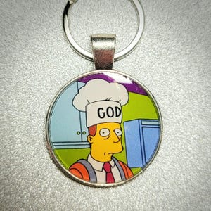 Troy McClure Someone's In The Kitchen with DNA Simpsons Pendant Keychain
