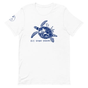 May include: White t-shirt with a blue silhouette of a sea turtle with palm trees and dolphins inside. The text "St. John U.S. Virgin Islands" is below the turtle.
