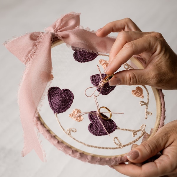 Rustic wedding ring holder with purple and pale pink crochet appliques on organza tulle on embroidery loom