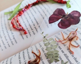 Bookmark with pressed flowers, clear view, with colourful ribbons