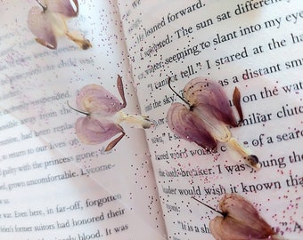 Bookmark with pressed flowers and feathers, with glitter, clear view, with colourful ribbons