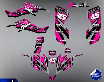 May include: Pink and black graphic design for a motorcycle with the text "Rockstar Energy Drink" and "Protaper" on it. The number 45 is also included in the design.