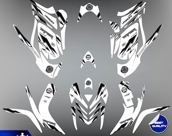 May include: Black and white graphic design kit for a Yamaha Raptor 700 ATV. The kit includes a variety of decals with the words "VForce4", "Raptor", "700", and "Bridgestone" printed on them.