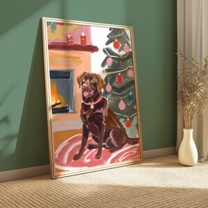 May include: A painting of a brown Labrador Retriever sitting in front of a fireplace with a Christmas tree behind it. The dog is wearing a red collar and has a pink rug under it.