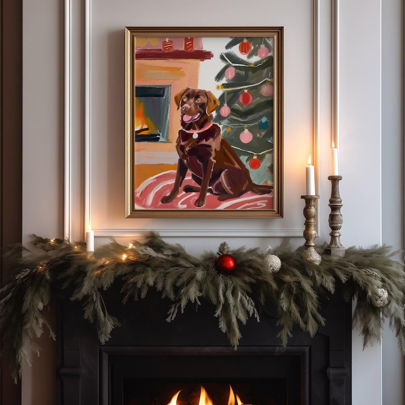 May include: A painting of a brown Labrador Retriever sitting in front of a fireplace and a decorated Christmas tree. The dog is wearing a pink collar and is looking at the viewer. The painting is framed in gold and is hanging on a white wall.