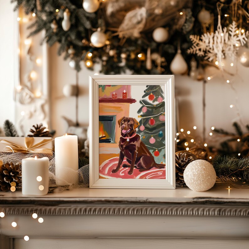 May include: A painting of a brown dog sitting in front of a fireplace and a Christmas tree. The dog is wearing a red collar and has a happy expression on its face. The painting is framed in white and has a pink background.