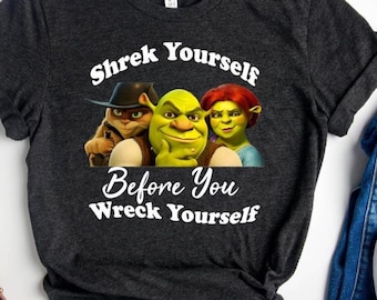 May include: Dark gray t-shirt with a graphic of Shrek, Fiona, and Donkey from the movie Shrek. The text on the shirt reads "Shrek Yourself Before You Wreck Yourself."