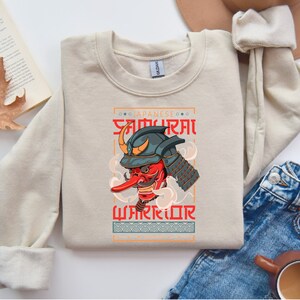 a sweater with an image of a demon on it