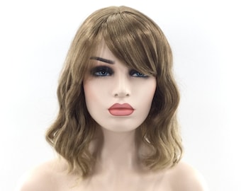 May include: A light brown wavy wig with a side part and bangs. The wig is styled in a shoulder-length bob.