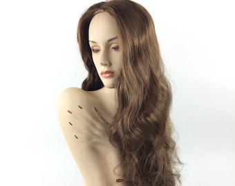 May include: A long, wavy, light brown wig on a mannequin head. The wig is styled with loose waves and falls to the shoulders.