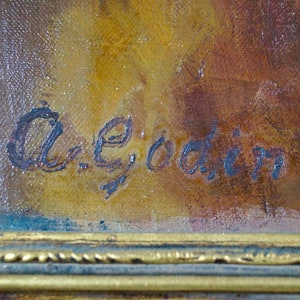 May include: A close-up of a painting's signature, written in blue ink on a canvas with a brown and yellow background. The signature reads "A.E. Goadin".