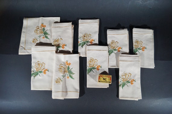 9 Hand embroidered napkins with golden roses