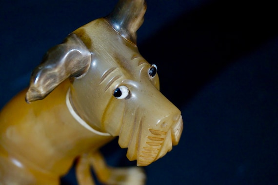 Carved from bone dog statuette