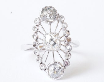 Art Deco marquise ring in platinum, gold, and diamonds.