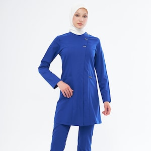 May include: A royal blue medical scrub set with long sleeves and pants. The top has a mandarin collar and a single button closure. The pants have a straight leg.
