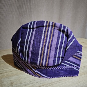 New Nigeria Purple Men’s Cap/Fila in Aso Oke Matching Gele/Ipele is available for Ladies