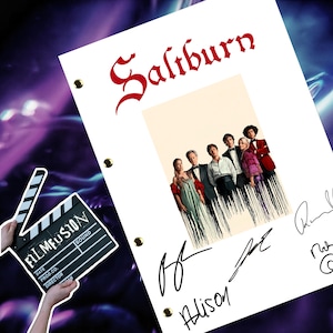 May include: A white page with the word "Saltburn" written in a white script font. A black and white photograph of a group of people is in the centre of the page. The photo is surrounded by black lines. There are several signatures on the page, including "Alison".