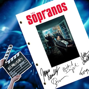 May include: A white script with the title "The Sopranos" in red text. A black and white photo of the cast of the show is in the center of the script. The script is signed by the cast members: James Gandolfini, Michael Imperioli, Steven Van Zandt, and Tony Sirico.