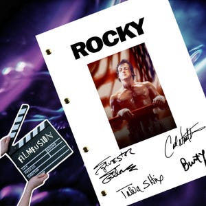 May include: A white script with the word "ROCKY" in black lettering. A black and white photo of Sylvester Stallone as Rocky Balboa in the boxing ring. The script is signed by Sylvester Stallone, Talia Shire, and Carl Weathers.